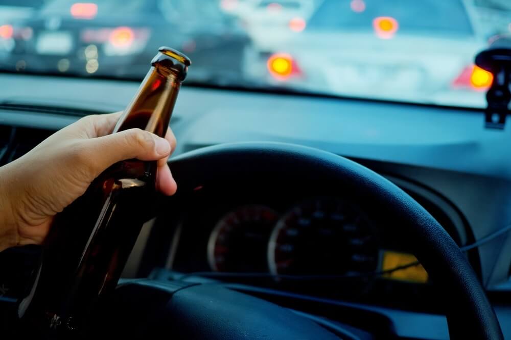 A bottle of alcohol in a driver's left hand while driving could be included in Buzzed Driving Penalties 